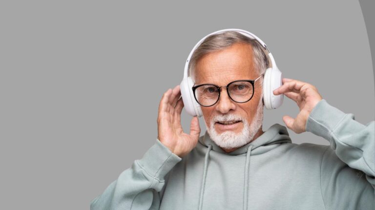 older man using headphones for notch therapy
