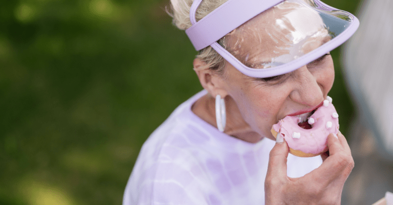 woman eating donut that caused tinnitus