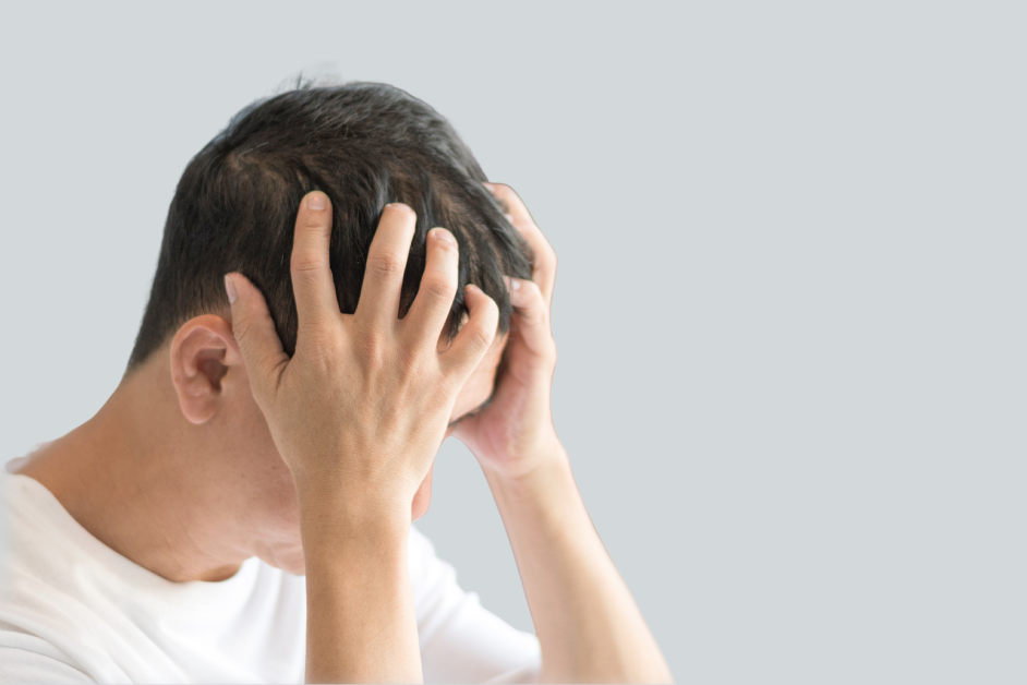 person with their head in their hands
