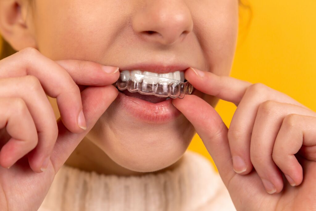 person using invisalign