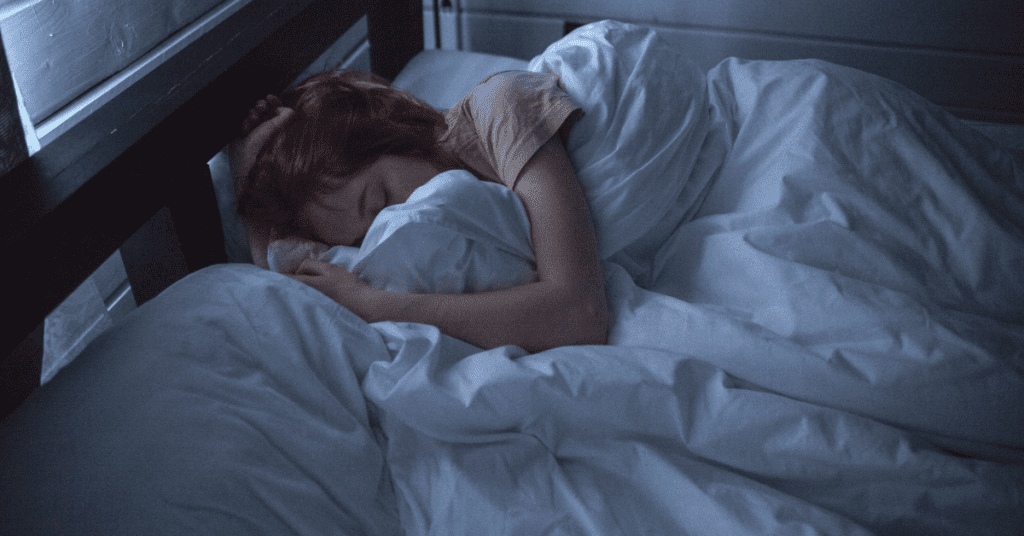 Woman sleeping in bed