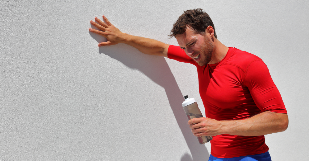 Man sweating and drinking water