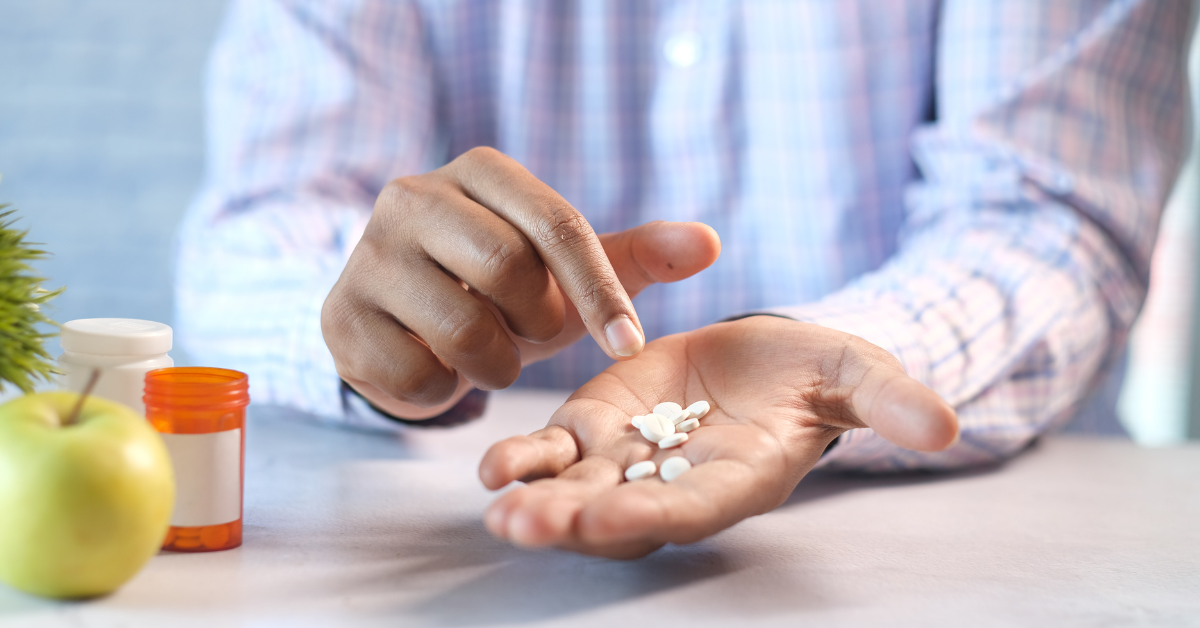 Loose pills in a persons hand