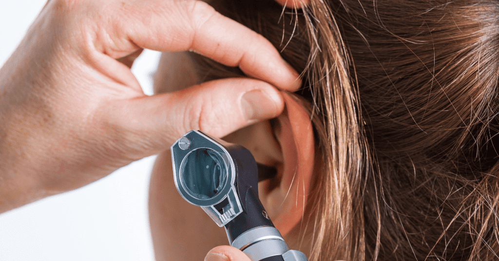 Person getting their ears checked at the doctor