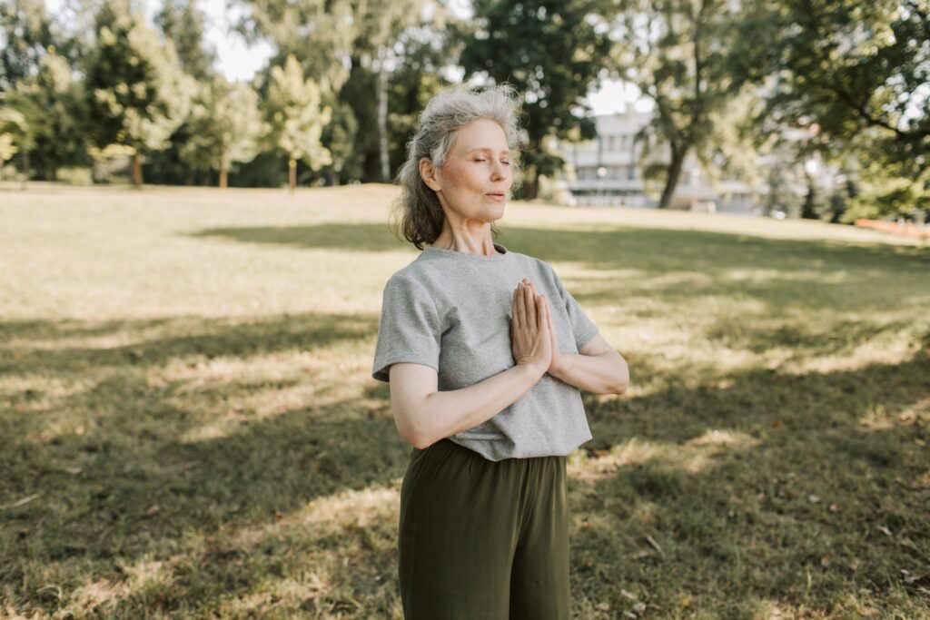 Woman meditating outside