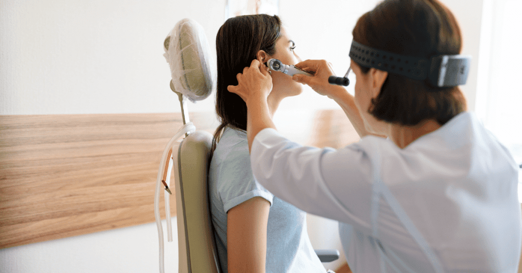 Woman getting an ear exam