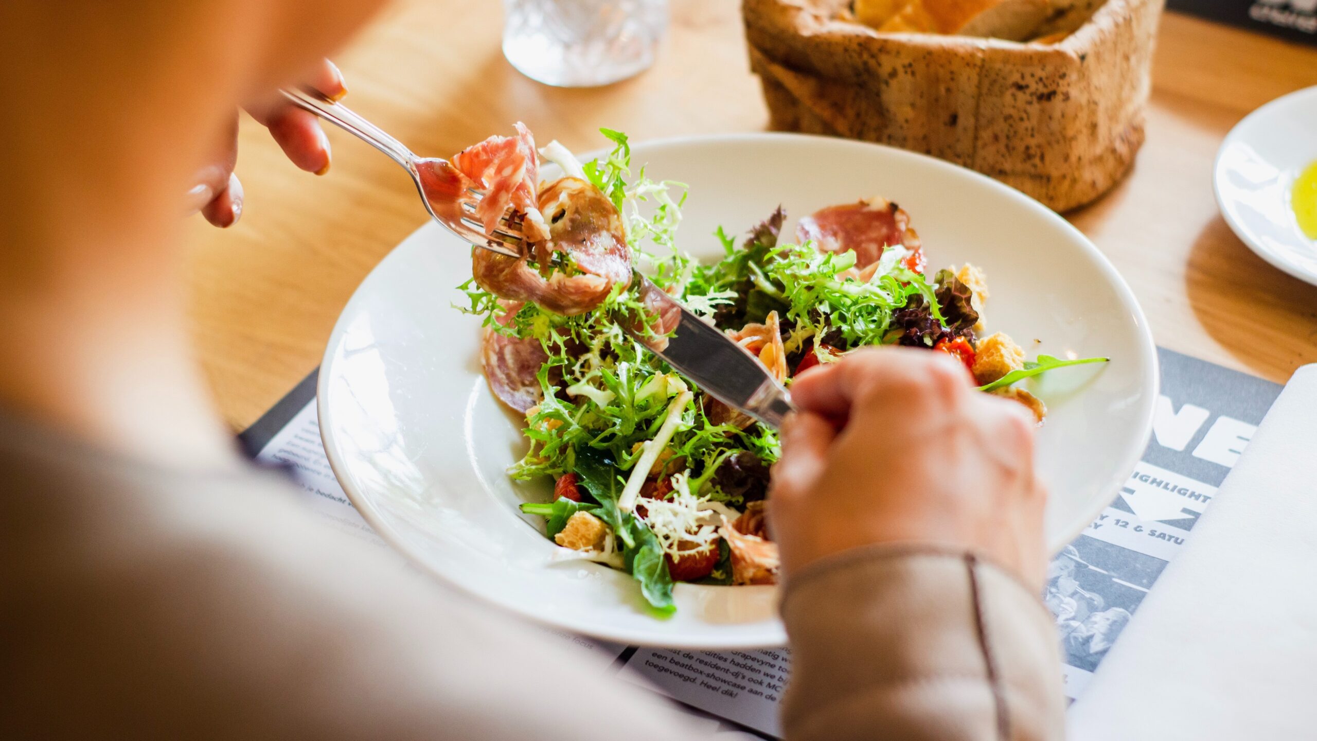 Person eating a salad