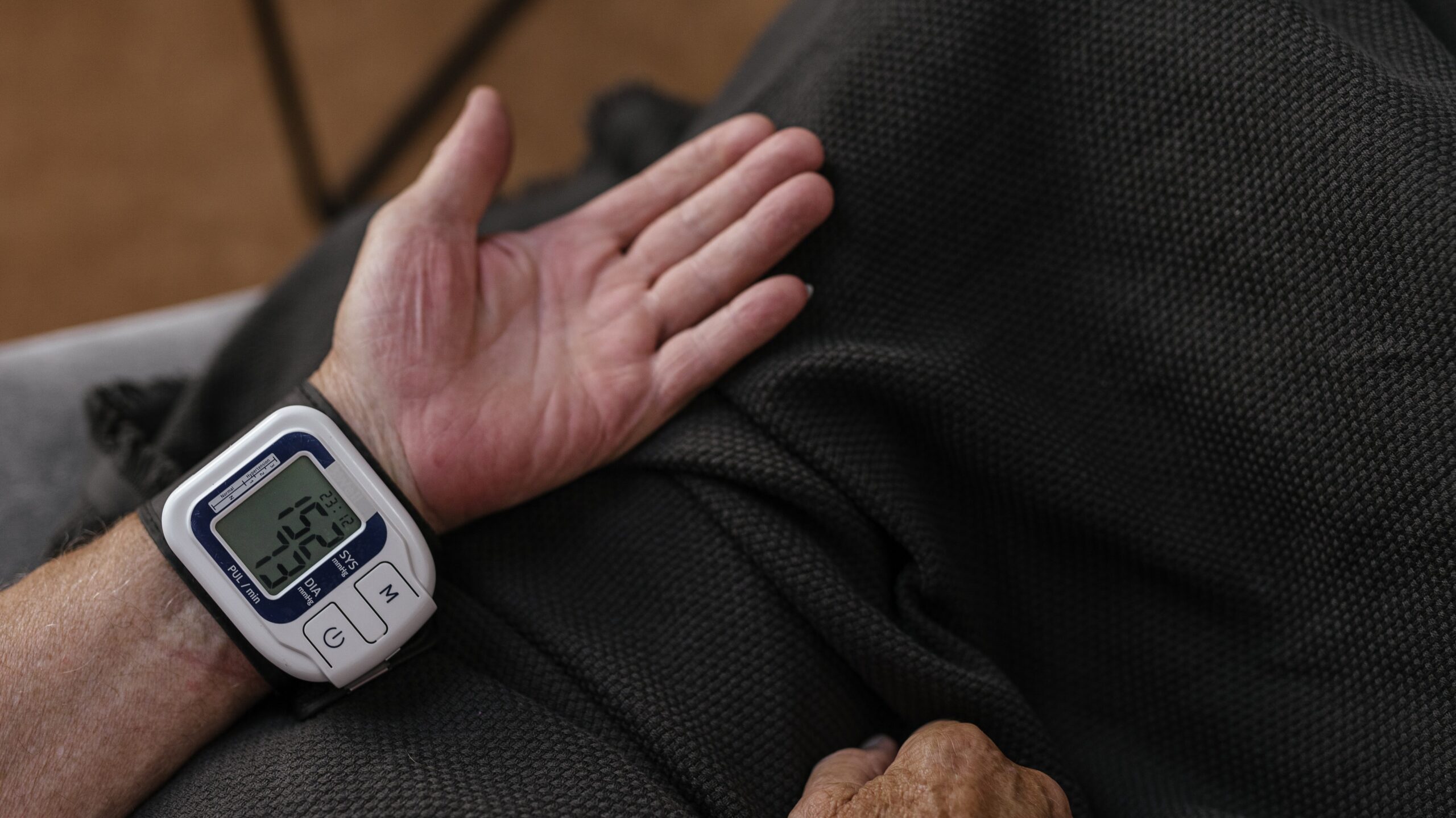 Person wearing a blood pressure monitor