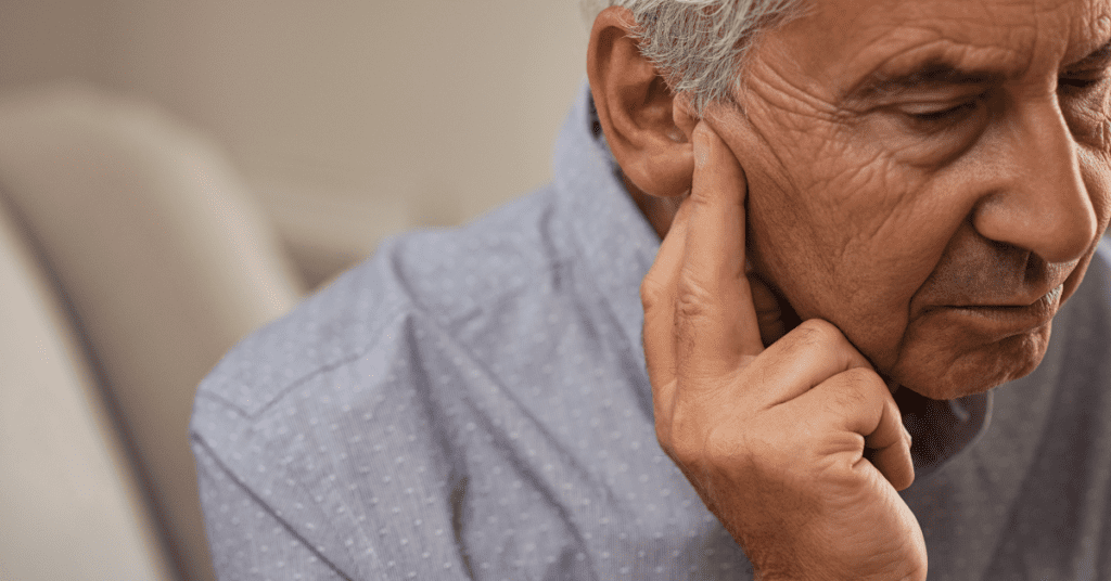 Older man with hearing loss