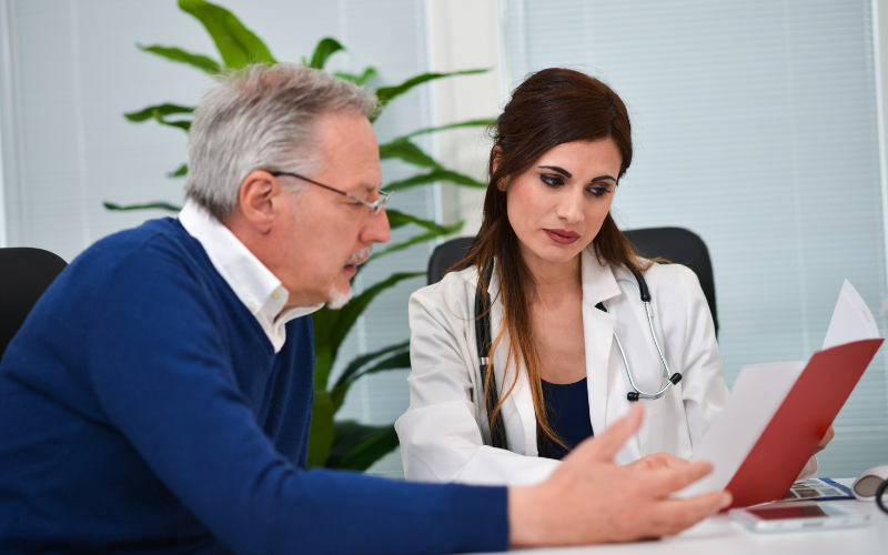 Older man speaking with his doctor