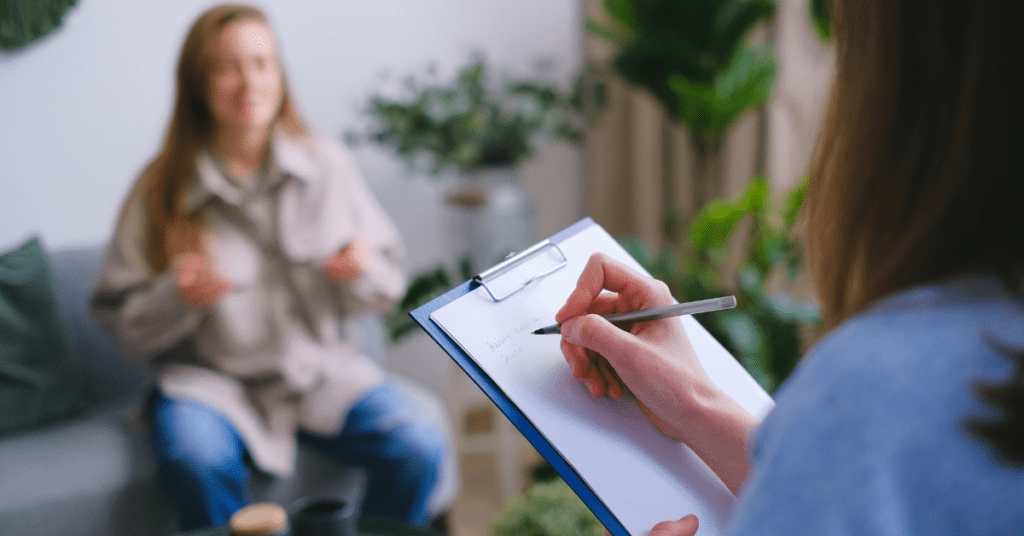 Doctor talking to a patient and taking notes