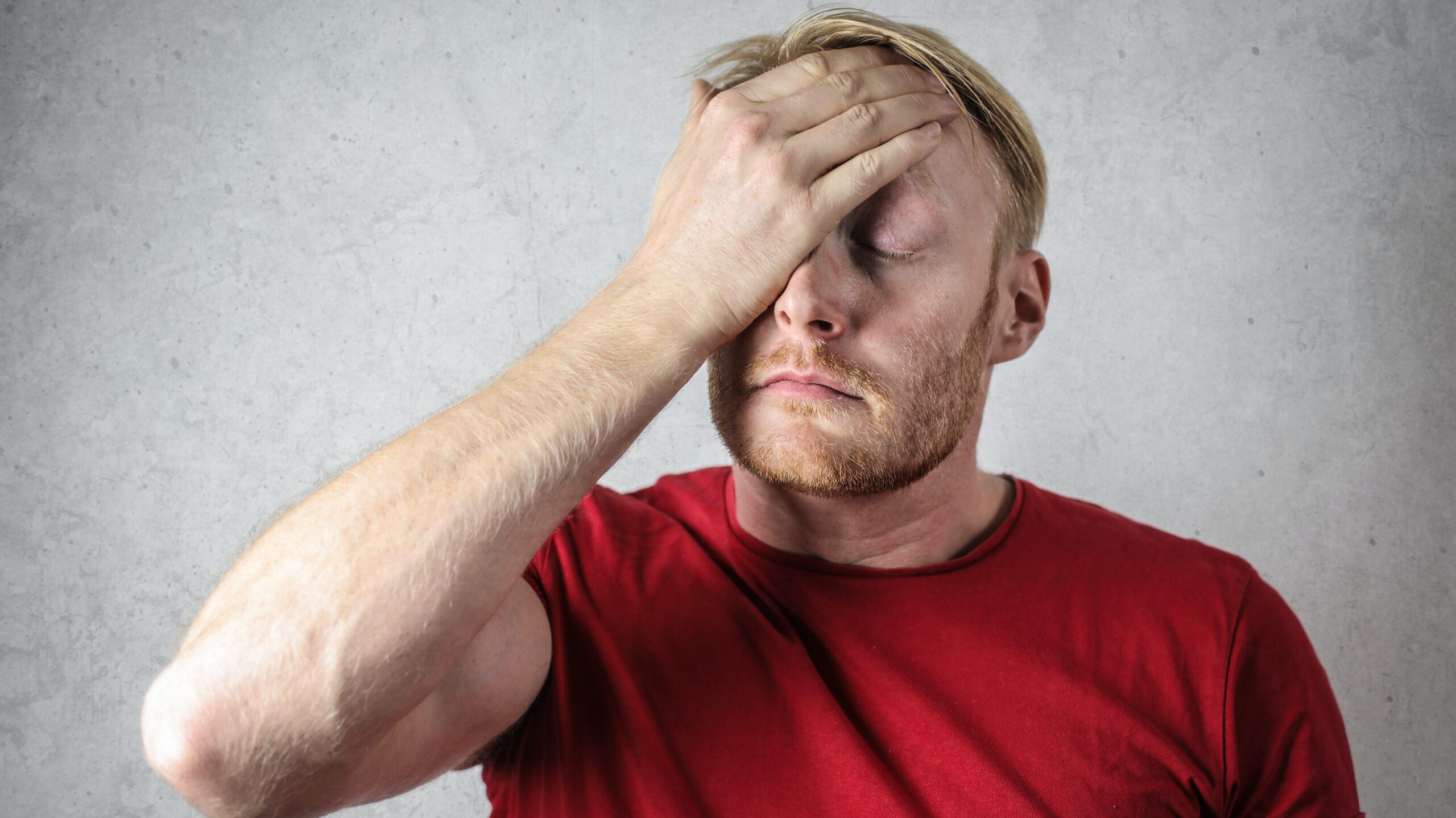 Man holding his face, stressed out