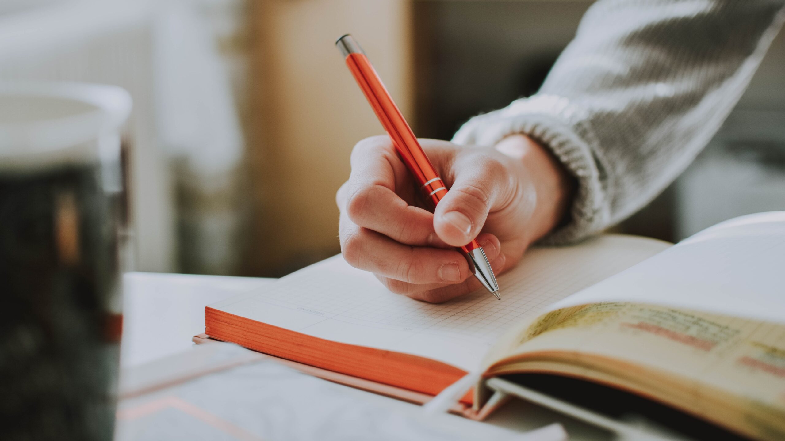 Person writing in a notebook