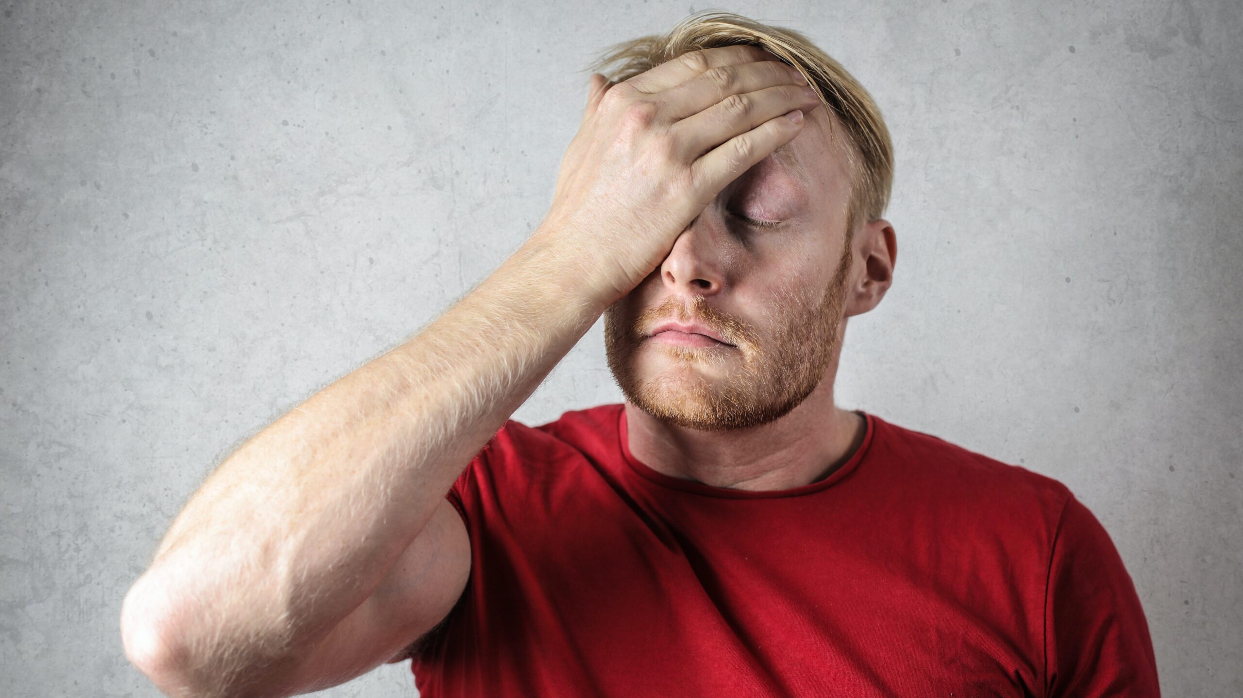 Man holding his head due to stress