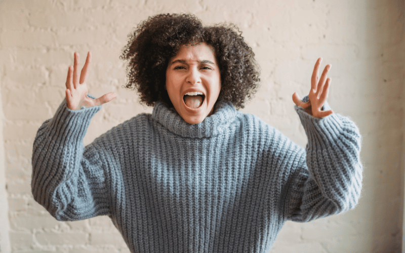 Woman reacting to a loud sound