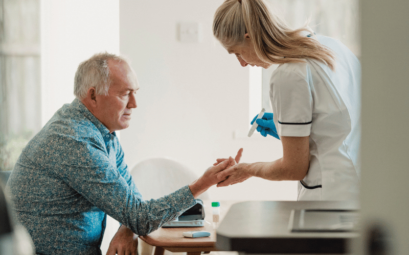 Man getting his insulin tested via a finger prikc