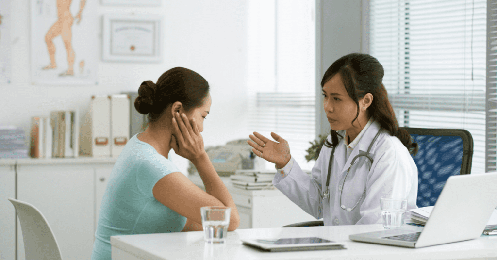 Patient with tinnitus talking to their doctor