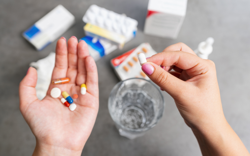 Person taking various medications