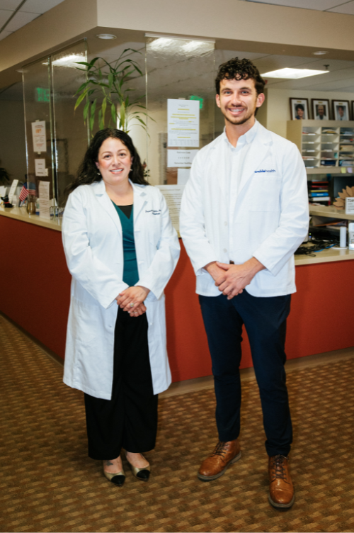 Dr. Ben Thompson and Dr. Priscilla Giler standing inside the Treble Health San Francisco office, ready to welcome tinnitus patients.